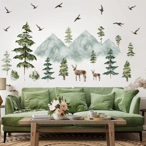 Peel And Stick Mountain Forest Wall Decals Set With Pine Trees Deer And Birds For Kids Room And Nursery Decor On A Large 15.7x47.2 Inch Sheet Woodland Stickers For Cozy Cabin Vibe, featuring forest scene over green sofa.