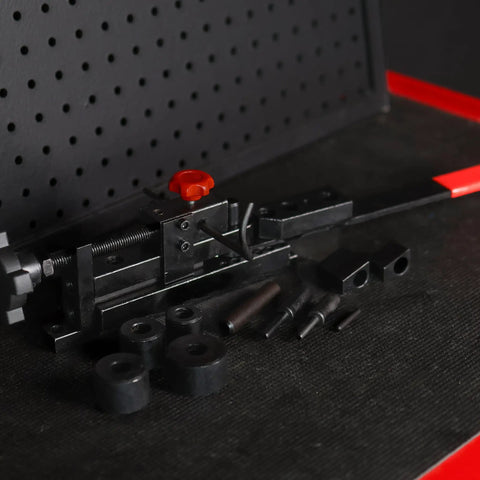 Mini Rod Bender Tool For Metalwork Universal Bending Machine for wire tubing, flat stock, coils, hooks, and clamps on a workbench.