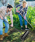 Two people using Beefy Rolling Lawn Aerator with fillable drum and 18 inch tine spikes for soil aeration in garden.