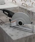 Heavy Duty 15 Amp Corded Angle Cutter With 14 Inch Super Joint System and AC Or DC Switch on concrete slab