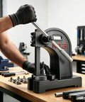 Heavy Duty Manual Arbor Press Machine 3 Ton Cast Iron Desktop Hand Tool For Stamping Forming Bending Stretching And Riveting Built Like A Tank Pro Shop Workhorse in use with operator holding the handle.