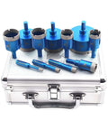 Diamond core drill bit set, 11pcs, front view; blue bits with triangle shanks in a silver metal case