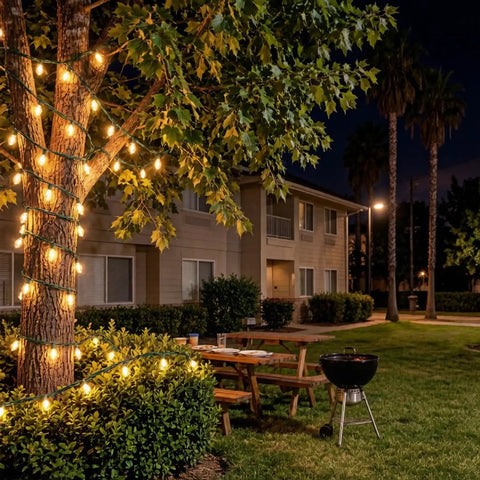 200 LED Warm White Christmas Lights On 66ft Green Wire UL Certified Commercial Grade illuminating tree in garden
