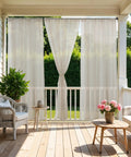 All Weather Outdoor Sheer Curtains 6 Pack For Patio And Porch, Rod Pocket Beige 54x84 Inches, hung on a porch for light diffusion.