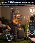 38.2 Inch Solar Powered Outdoor Water Fountain with Four Tier Cascading Bowls and Stacked Stones LED Lights in garden setting
