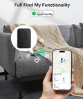 iPhone showing full Find My tracking for MagSafe Wallet with real-time location and alerts on a gray couch with knitted blanket.