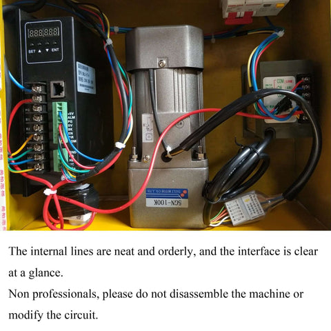 Yokoma portable line boring machine components inside a yellow electrical cabinet; silver motor, black control box, multi-color wiring