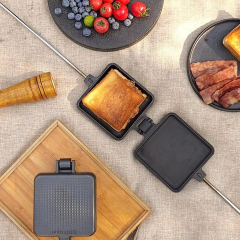 Large Cast Iron Campfire Pie Iron Set For Outdoor Cooking 4.9 Inch Pies and toasted sandwich on wooden board with fruits