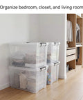 Straight Up Premium Clear Storage Bins With Secure Seal Lids And Heavy Duty Handles For Game Changing Closet Organization Plus No Sweat Home Office And Garage Solutions stacked in a corner, filled with folded towels.