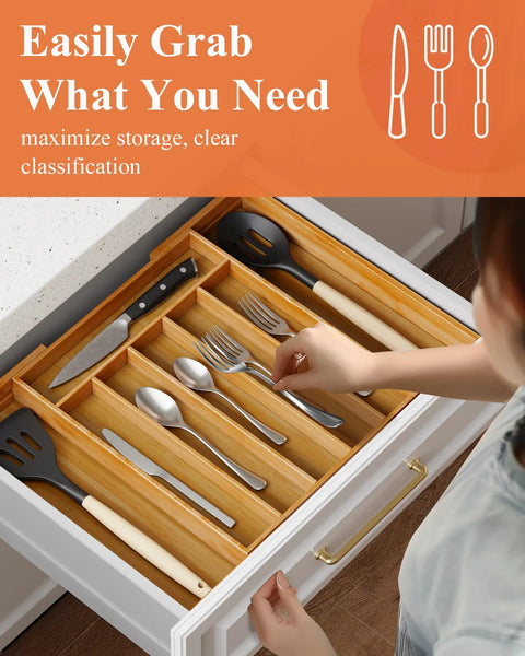 Person using an Expandable Bamboo Silverware Organizer For Drawers, Ultra Roomy 6 To 8 Slot Utensil Tray with natural finish in a kitchen drawer.