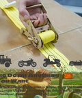Heavy Duty E Track Ratchet Straps 8 Pack Tie Down Cargo Slings 2X15 Feet Yellow in use, securing cargo with a ratchet mechanism.