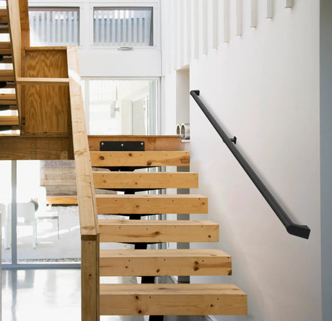 Heavy Duty Aluminum Handrail Set For Indoor Outdoor Stairs 16 Foot Wall Mounted Grab Bar Rock Solid Seamless Rust Free Matte Black Finish With Straight Up Secure Grip installed on modern wooden stairs.