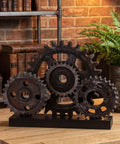 Novabright Vintage Copper Steampunk Gear Train Figurine For Desk Decor, rustic wood and metal cog wheel ornament on shelf.