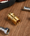 Close-up of Eight Piece Three Quarter Inch Brass Press Fittings Set With Press To Male Thread MIP NPT Adapters on wooden surface