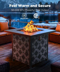 28 Inch Propane Fire Pit Table With 50000 BTU Heat Output CSA Certified Outdoor Gas Fire Pit For Patio Removable Lid And Lava Rocks Brings Cozy Glow And Vibe To Backyard Parties with flames glowing at night on a patio.