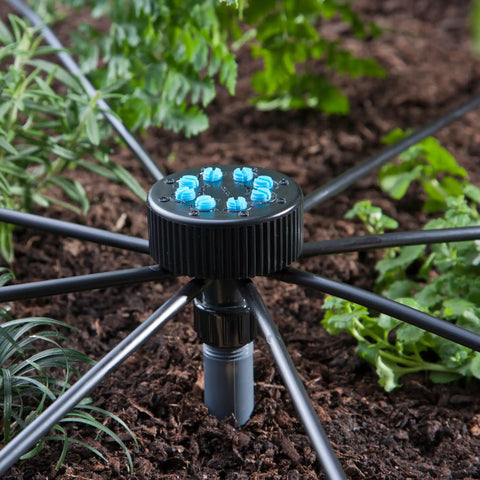 Eight Outlet Adjustable Bubbler For Drip Irrigation Systems Turns Underground Lines Into Precise Micro Drip Watering, installed in garden