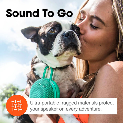 Woman holding dog with Clip 3 Fiesta Red Portable Bluetooth Speaker With Up To 10 Hours Of Playtime, Waterproof And Durable attached.