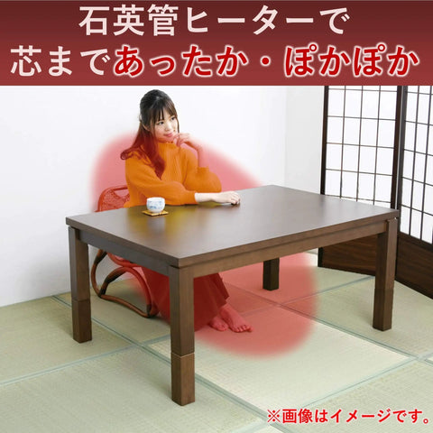 Replacement 600W Heater For Japanese Kotatsu in use under table, cozy living room setting with woman enjoying warmth, energy efficient