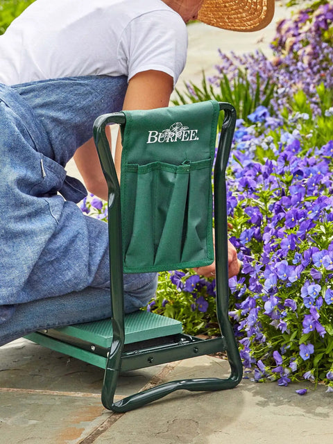 Do It All Garden Kneeler Seat With Padded Cushion And Detachable Tool Bag used while gardening by a person tending flowers