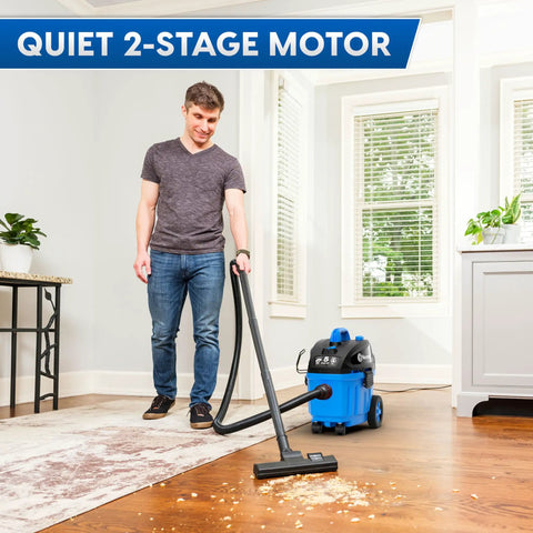 Man using 4 Gallon Wet Dry Vacuum With 5 Peak HP Two Stage Industrial Motor Workhorse Shop Vacuum For Home Garage
