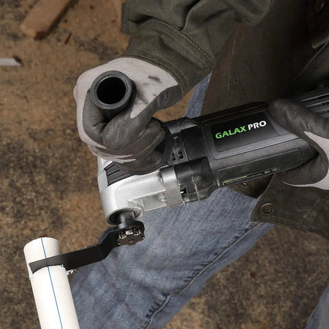 Person using Heavy Duty Pro Grade Oscillating Multi Tool Kit With 6 Variable Speeds 3.5A Quick Clamp System on PVC pipe