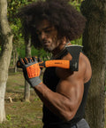 Person holding Compact Outdoor Camp Hatchet For Splitting And Kindling Wood With Forged Steel Blade in forest setting