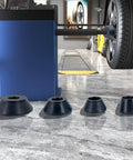 Top Shelf Four Piece Wheel Balancer Taper Cone Set Built Tough With Heavy Duty Forty Five Steel For 40mm Shafts and Universal Fitment on Cars and Trucks Ride Ready Garage Must Haves displayed in a garage setup.