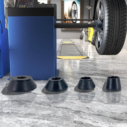 Top Shelf Four Piece Wheel Balancer Taper Cone Set Built Tough With Heavy Duty Forty Five Steel For 40mm Shafts and Universal Fitment on Cars and Trucks Ride Ready Garage Must Haves displayed in a garage setup.