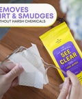 Front view: See Clear Original Lens Wipes in a yellow pouch with purple label; cleaning eyeglasses.
