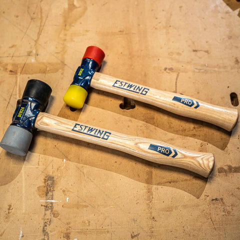 12 Oz Double Face Rubber Mallet With Soft And Hard Tips And Hickory Handle Built With Triple Wedge Construction For Framing Roofing Carpentry And Pro Grade DIY Projects A Versatile Tap Tool For Sheet Metal And Assembly, showing two mallets on a wooden surface