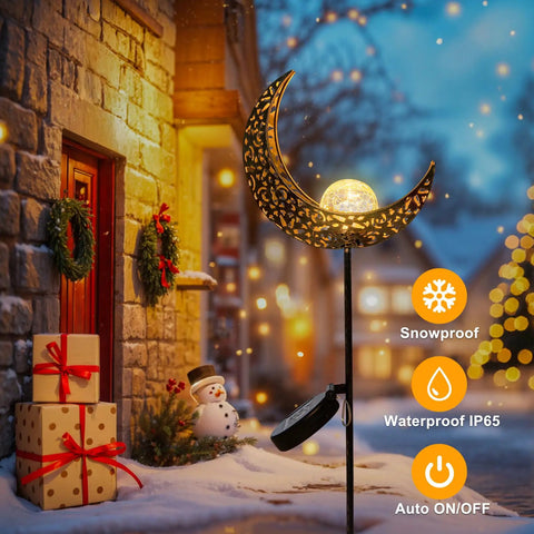 Moon Solar Garden Lights Outdoor Waterproof Stake Yard Decor for Lawn Patio Bronze Finish illuminating a snowy pathway at night.