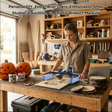 Artilume T1 laser engraver, front view on wooden workbench; blue foldable engraving and cutting machine.