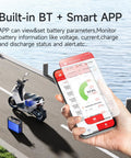 Smartphone displaying battery stats for No Sweat Smart Bluetooth Battery Bms 30Amp while near an e-bike.