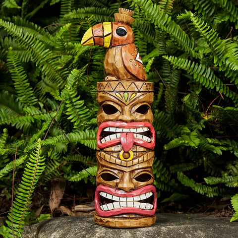 Outdoor Tiki Statue Decoration Solar Garden Figurine With Woodpecker On Top, 15 inch tall against green foliage