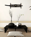 One Tier Katana Wall Mount Sword Holder With Red Velvet Padding above a minimalist tea table setting