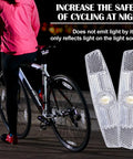 Cyclist at night with bicycle featuring Six Piece Bicycle Spoke Reflectors White Safety Wheel Reflectors Set for Road and Mountain Bikes.