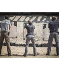People at shooting range wearing the Beefy 1.5 Inch Nylon Tactical Belt With Stainless Steel Buckle Converts To Tie Down Or Harness Heavy Duty Everyday Belt For Men And Women Charcoal Large Style 59409