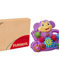Totally Awesome Dope Monkey Gears Stacking And Spinning Toy With Nine Interchangeable Plastic Cogs next to its box.