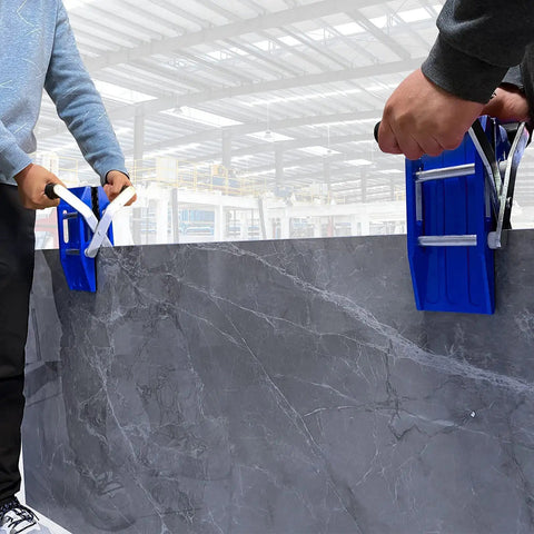 Two workers using 2-Pack Stone Granite Carrying Clamps Handed Panel Carriers for Granite and Marble Panels in a warehouse.