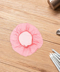 120pc Fire Sprinkler Dust Guards That Keep Grit Out Of Your Gear Heavy Duty Elastic Caps on wooden surface.