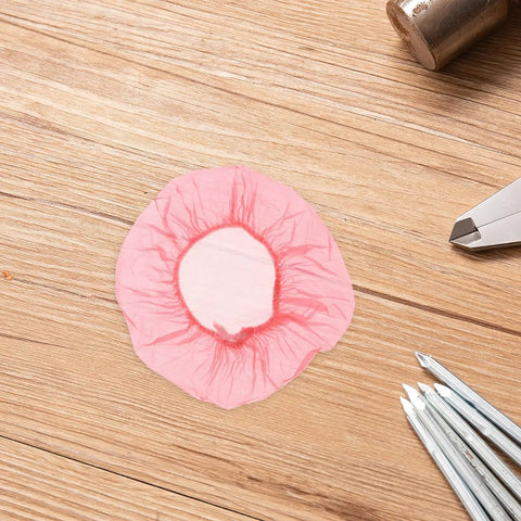 120pc Fire Sprinkler Dust Guards That Keep Grit Out Of Your Gear Heavy Duty Elastic Caps on wooden surface.
