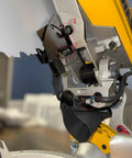 Side view of Enhanced Dust Collection Port for DWS779 and DWS780 Miter Saws, showing hose adapters and setup details.