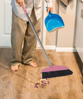 Long Handle Broom With Dense Stiff Bristles Heavy Duty Floor Sweeper Built For Yards Driveways Garages Low Bend Build in use on wood floor.