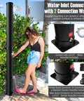 Woman using Solar Heated Outdoor Shower With 10 Gallon Tank 360 Degree Rotating Shower Head Foot Tap Freestanding 7.2 Ft Kit For Backyard Beach And Garden Easy Setup Black.