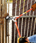 Person using Pro Grade 24 Inch Center Cut Cutter With Drop Forged Alloy Jaws For Beefy Heavy Duty Use on metal chain fence.