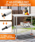 Stainless Steel Work Table For Food Prep And Heavy Duty Kitchen Station 24 By 36 Inches With Adjustable Undershelf Pro Grade Commercial Utility Table shown outdoors with adjustable feet for leveling.