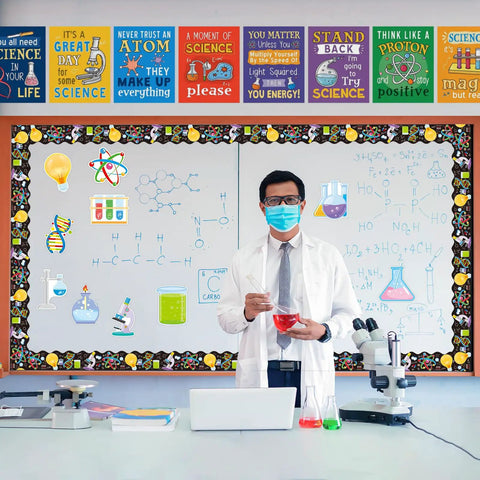 Science Cutouts Pack 45 Pieces With 15 Designs displayed in a classroom with microscope and teacher holding test tube