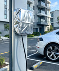 Tough As Nails Waterproof EV Charging Station Cover With All Season Dust Shield For Wall Mounted Electric Vehicle Plugs And Outdoor Home Chargers on parking wall.