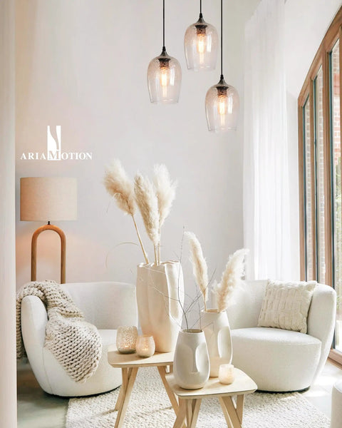 Three Light Teardrop Glass Pendant Chandelier With Hand Blown Seeded Bubbles hanging in modern living room