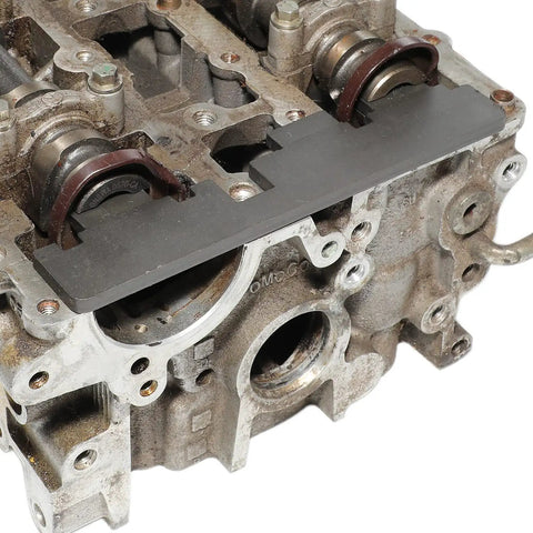 Close-up of camshaft locking tool on engine block from Pro Grade Engine Timing Kit With Camshaft Locking Tools For Ford Duratec EcoBoost Ti VCT 1.6 And 1.5 VVT Engines Plus Mazda Duratec 1.4 1.6 1.8 2.0 Cam Holding Tool And Flywheel Locking Set